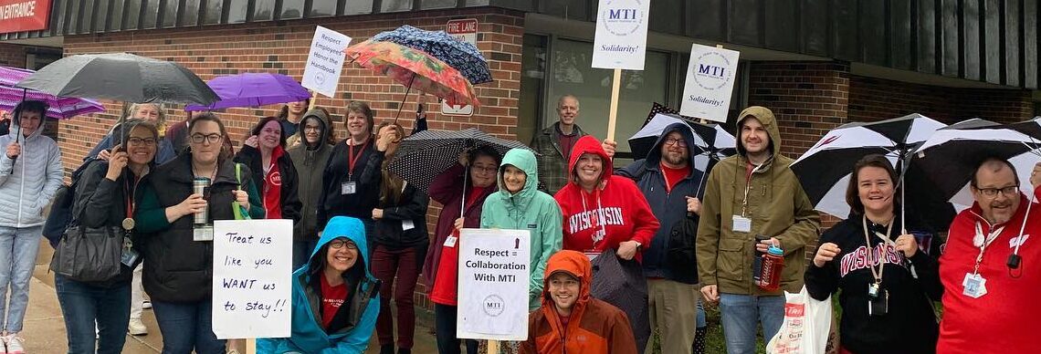 Teachers and Professional Staff Rallying for Respect in the rain.